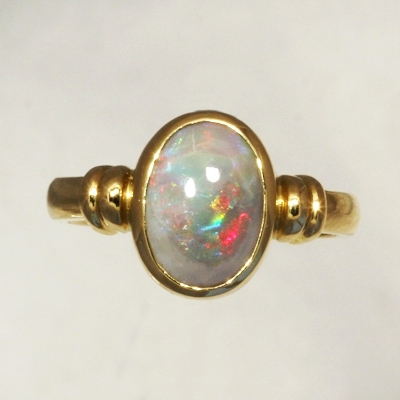 CUSTOM MADE 18k Yellow Gold Ring with a SOLID SEMI BLACK OPAL Rolling flashes of red to blue to green 